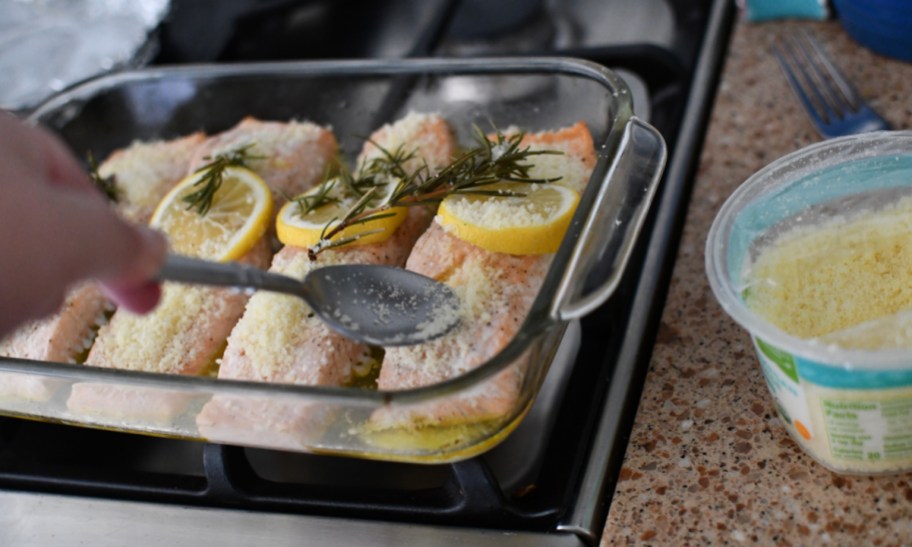 Placing Parmesan Cheese over easy baked salmon