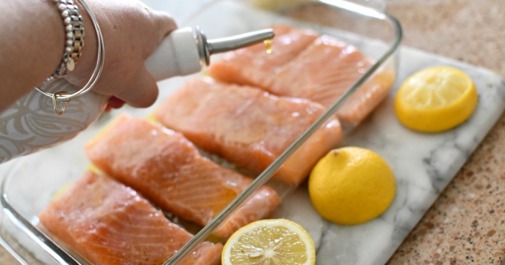 putting olive oil over fish
