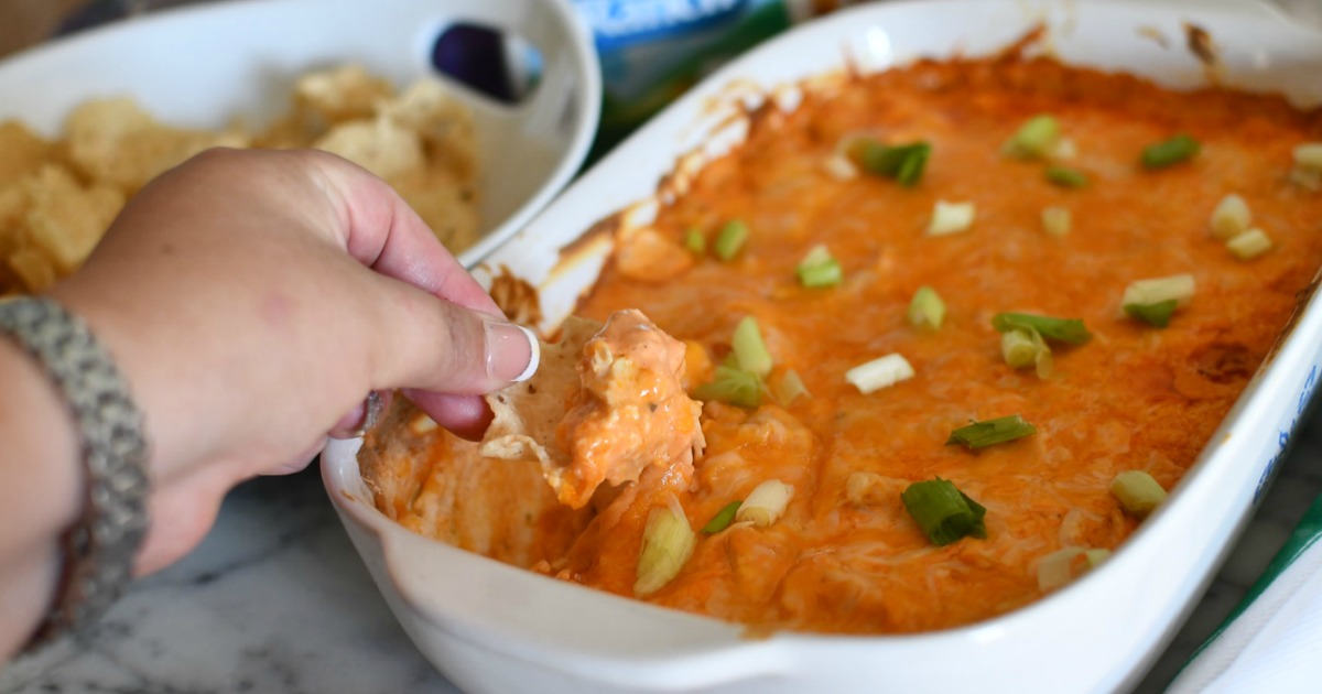 dipping a chip in buffalo chicken dip