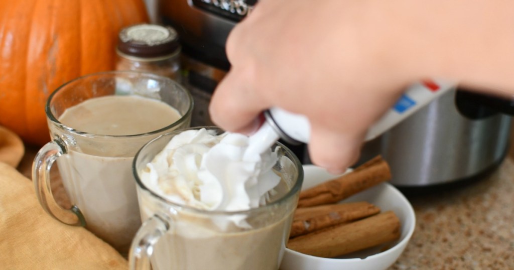 adding whipped cream to slow cooker pumpkin latte