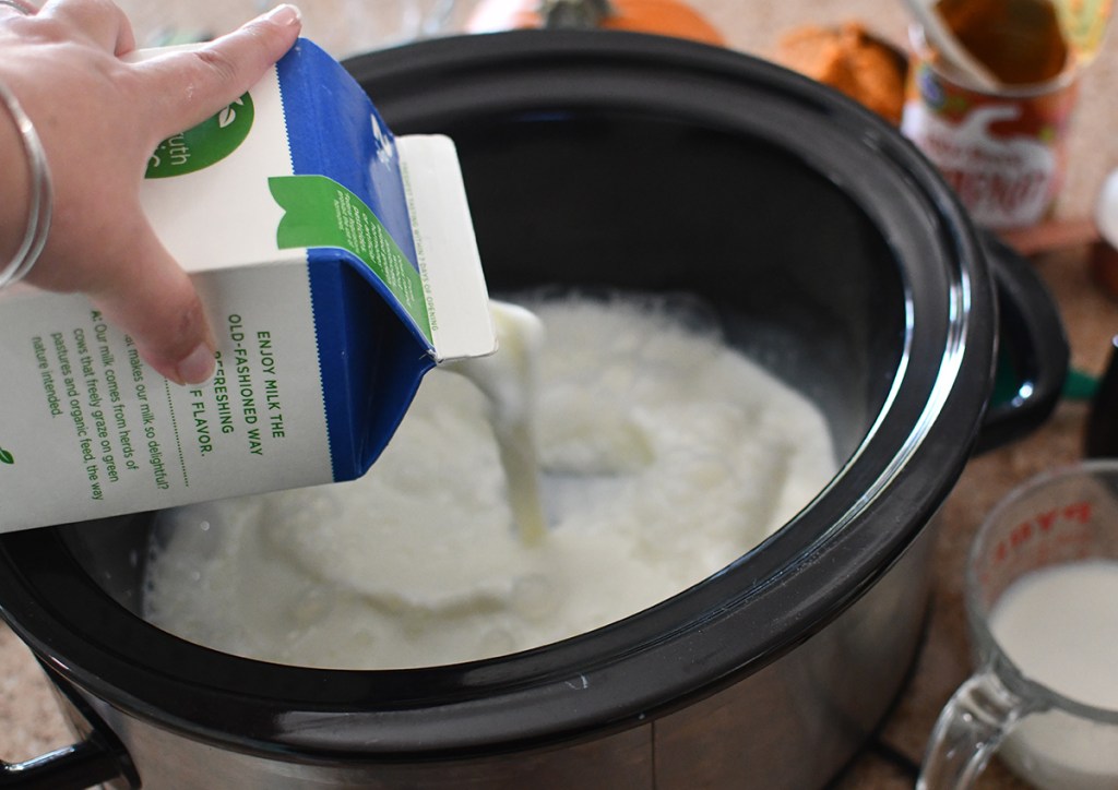 pouring milk into crockpot