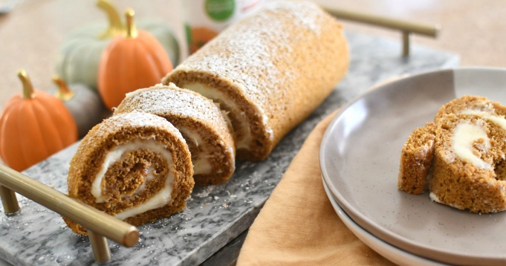 pumpkin roll sliced up on a tray