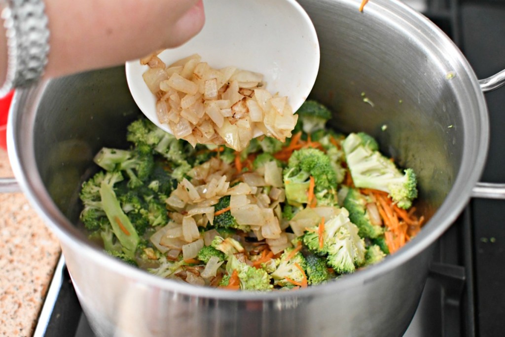adding sauteed onion to broccoli cheddar soup
