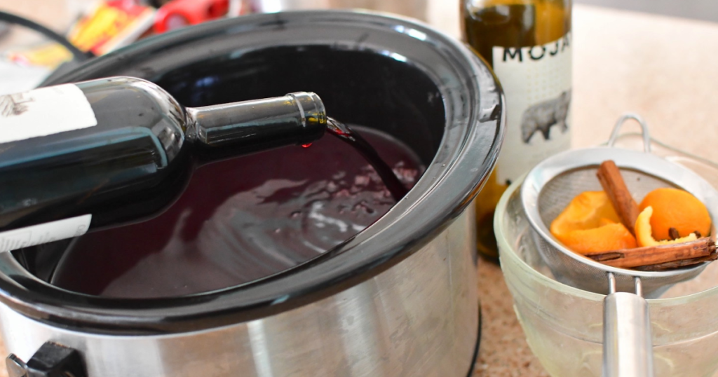 pouring wine into Crockpot
