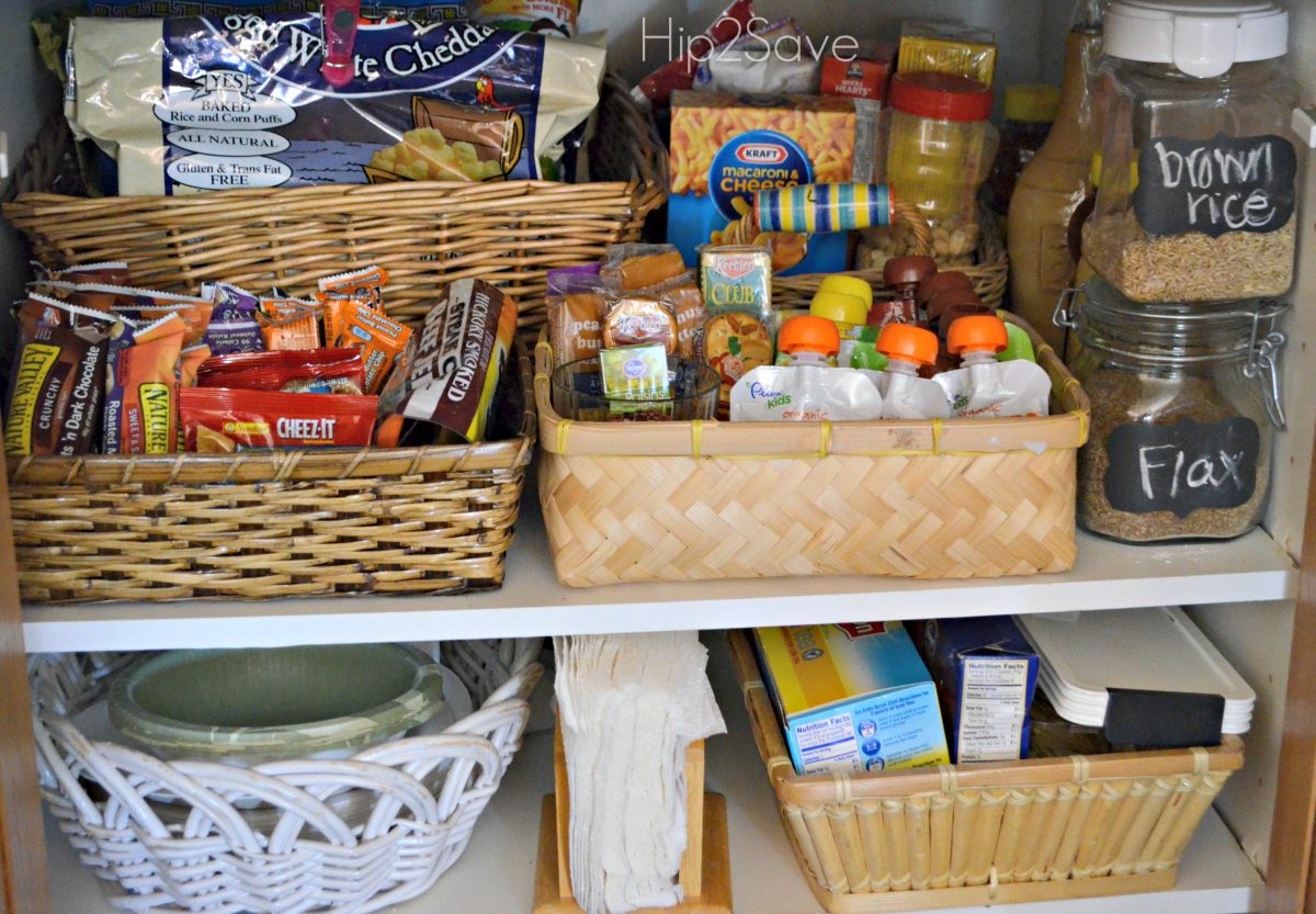 Organizational baskets in kitchen pantry with school lunch snacks