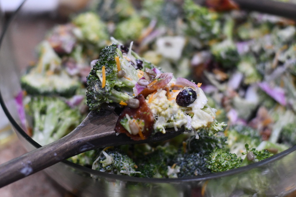 broccoli bacon salad on spoon