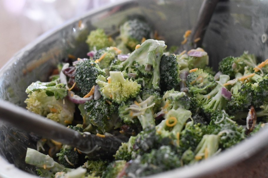 mix broccoli bacon salad in metal bowl 