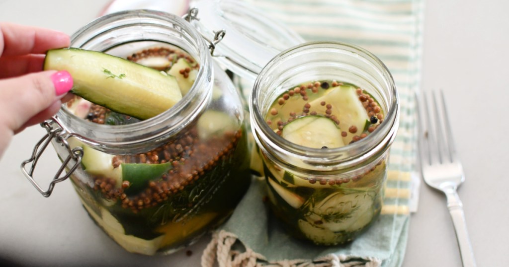 grabbing a pickle from a jar