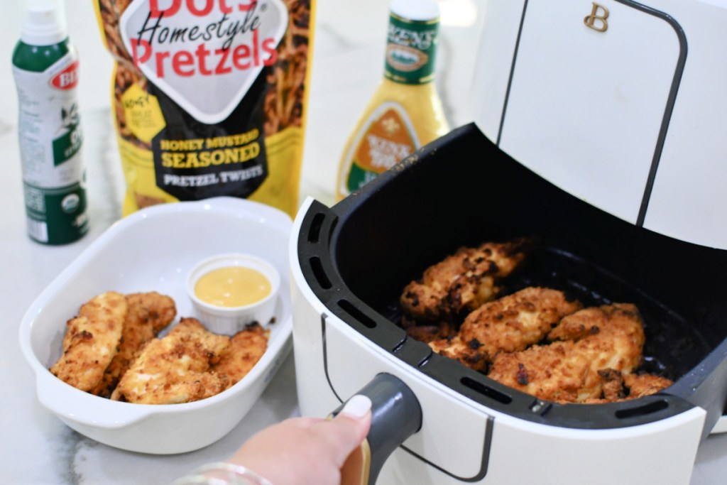 air fryer chicken tenders with honey mustard pretzel breading on the counter 