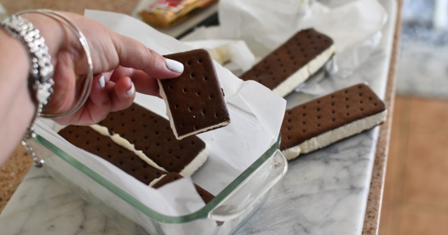showing how to make an ice cream sandwich cake using store-bought ice cream sandwiches