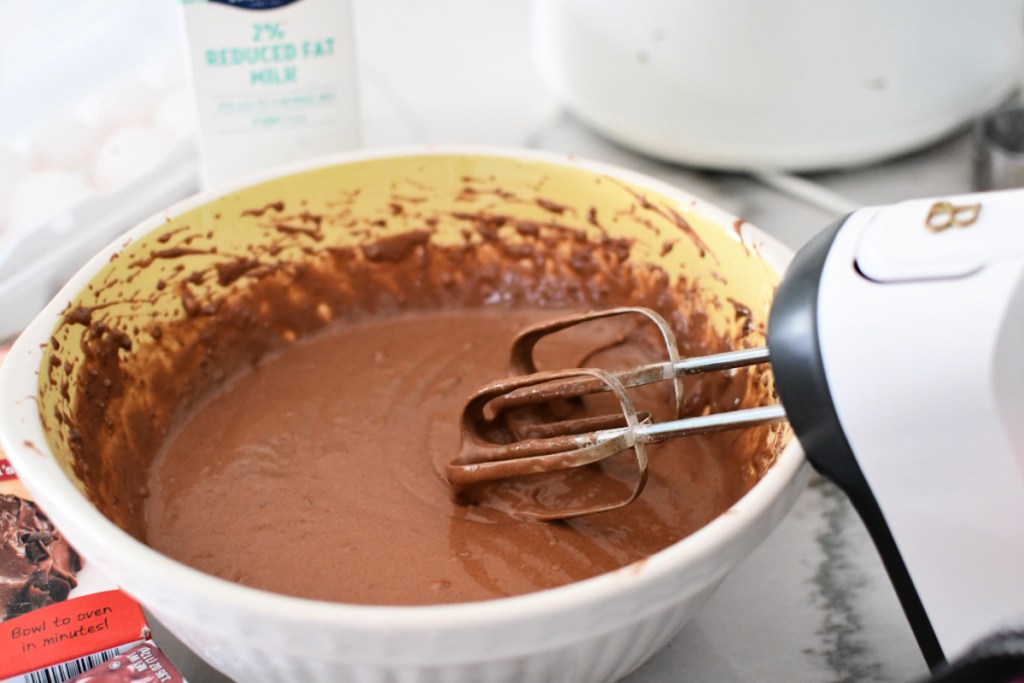 mixing cake in a mixing bowl with beautiful hand mixer