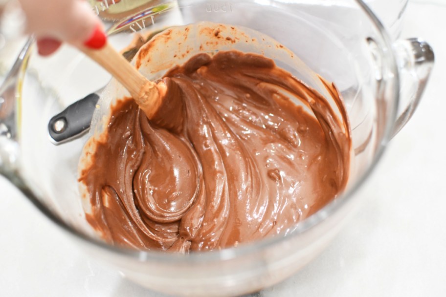 stirring melted chocolate and peanut butter