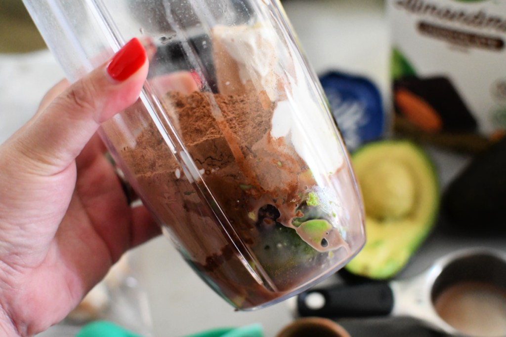 making a chocolate avocado smoothie