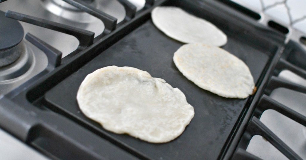 making tortillas on a gas stove griddle