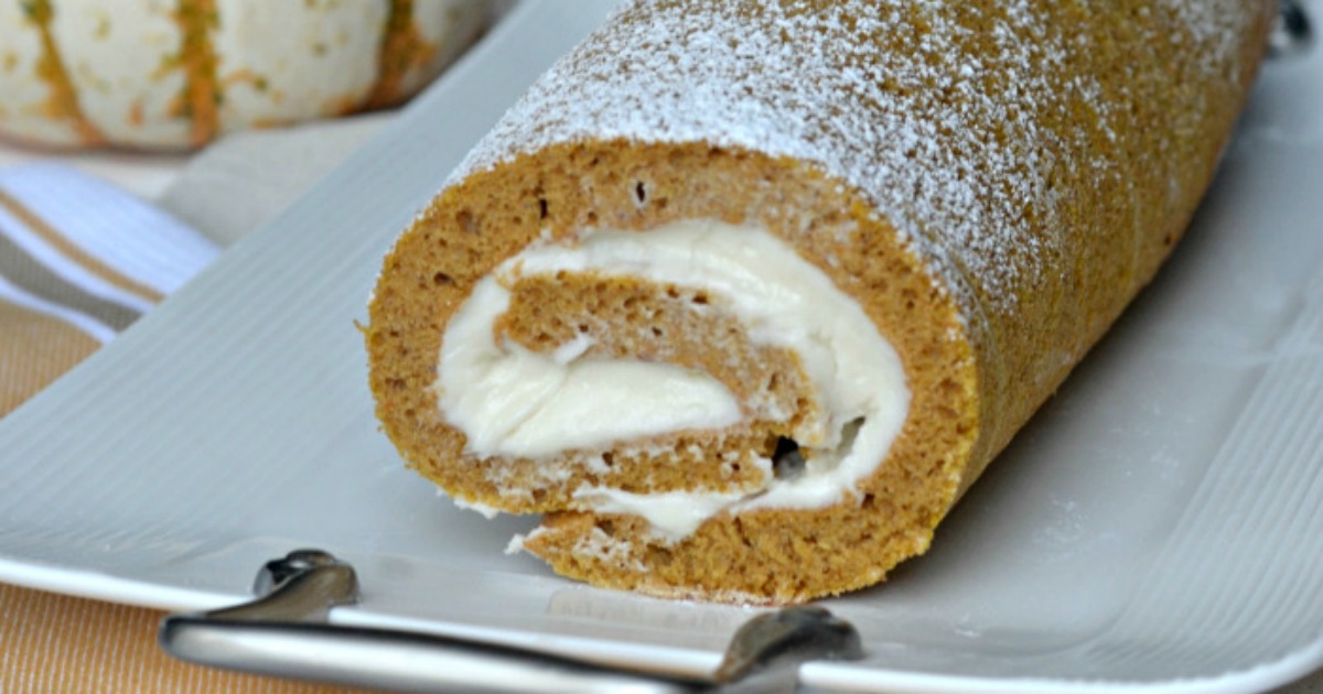 pumpkin roll with cream cheese frosting recipe on a serving platter 