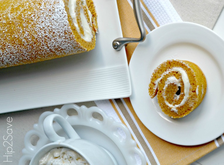pumpkin roll with cream cheese frosting recipe rolled up and sliced for serving