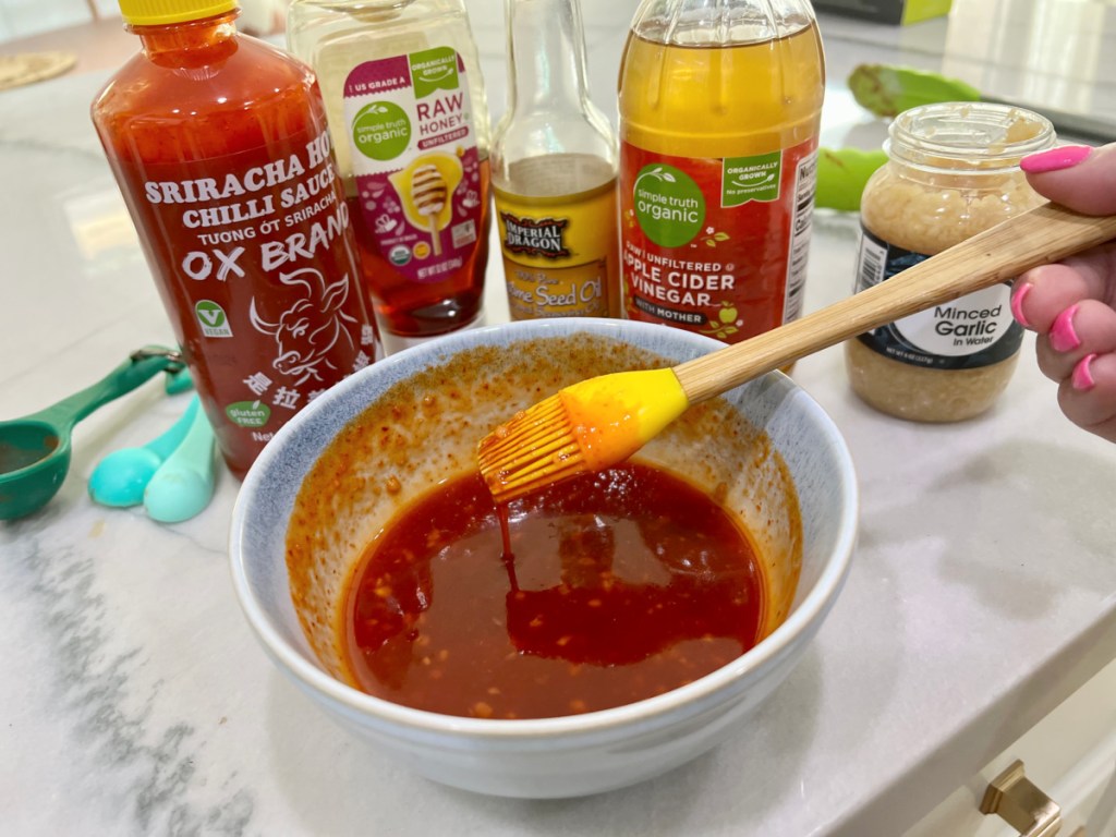 mixing honey siracha wing sauce