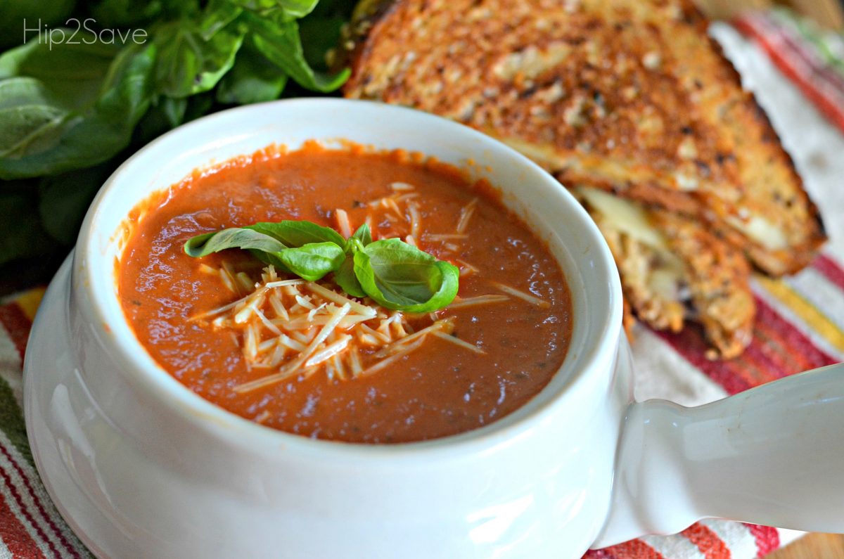 Easy tomato soup recipe in a bowl next to a sandwich