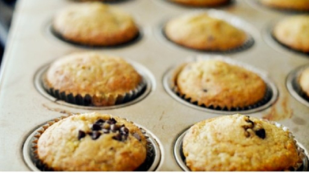 low sugar banana muffins in a muffin pan after baking 