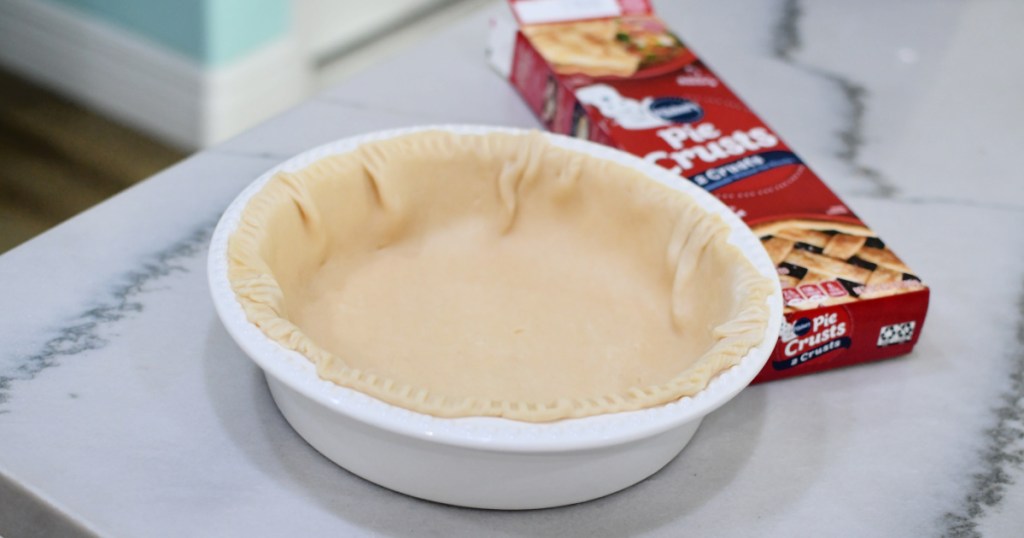 pillsbury pie crust in a white pie pan