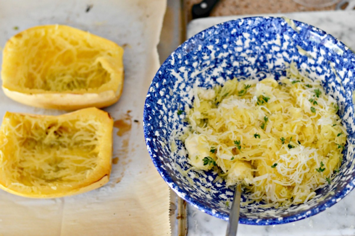 spaghetti squash carved out and served in blue bowl