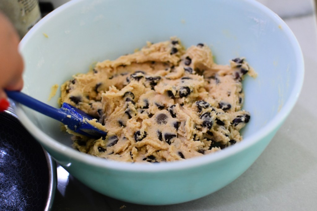 mixing chocolate chip cookie dough