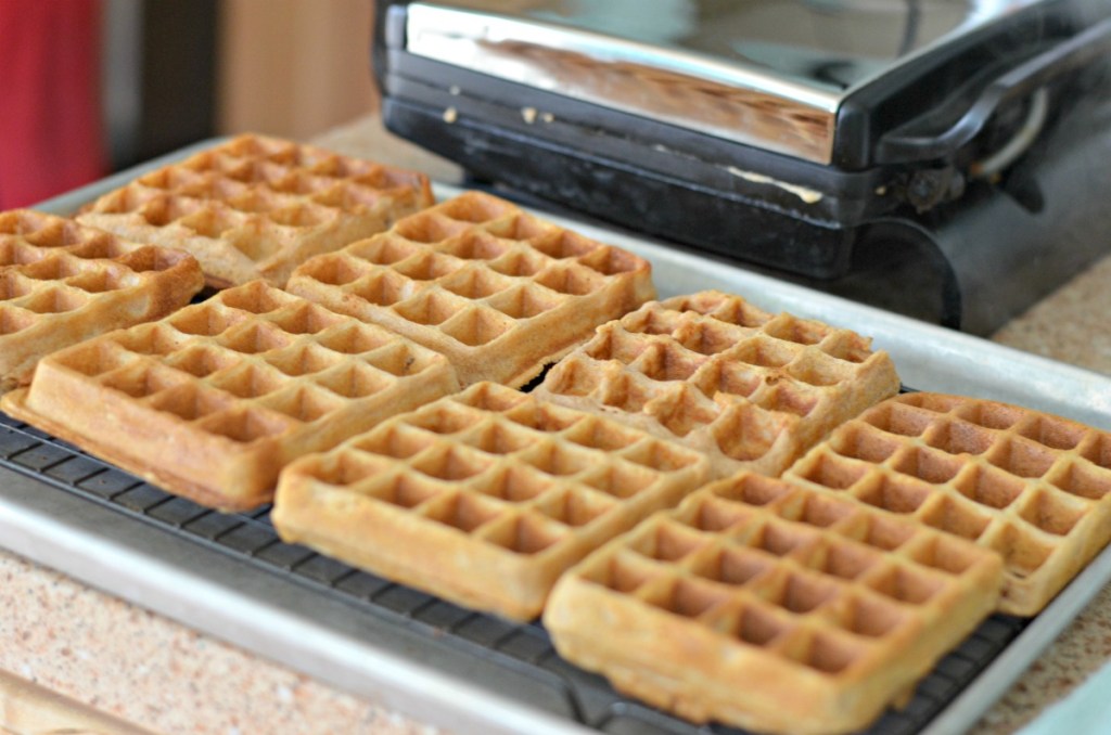making homemade waffles in a waffle iron