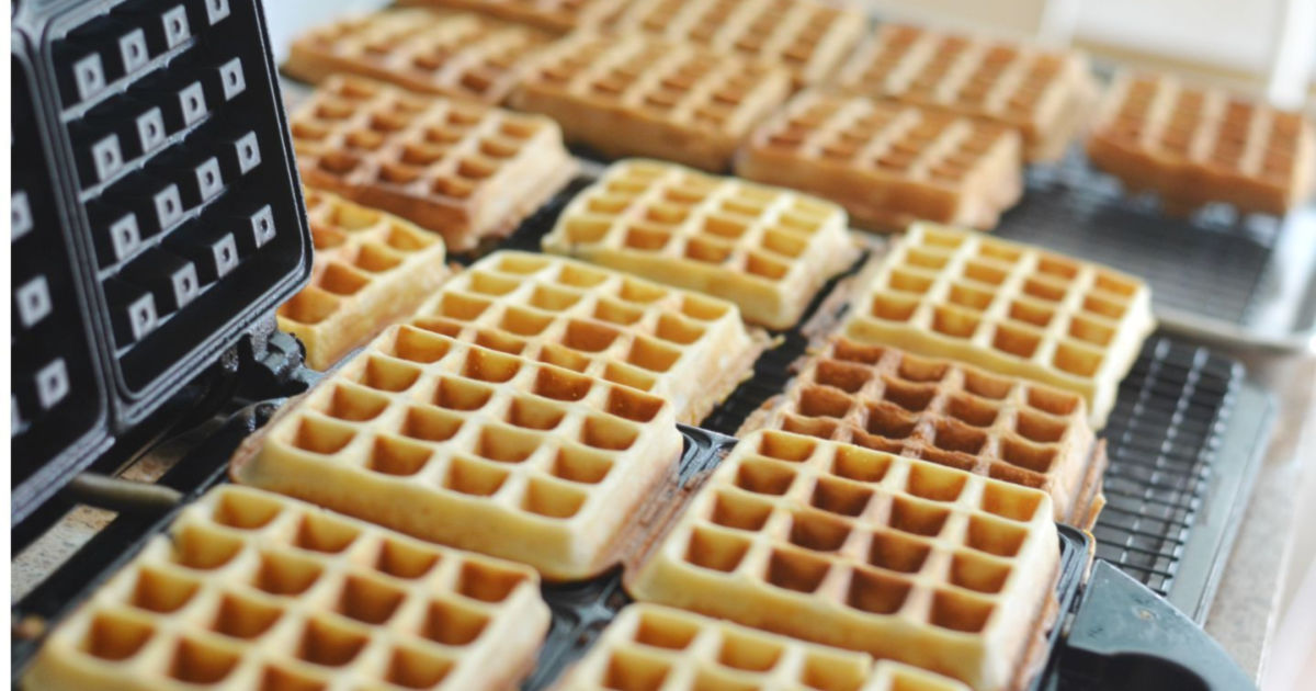 making homemade waffles in a waffle iron