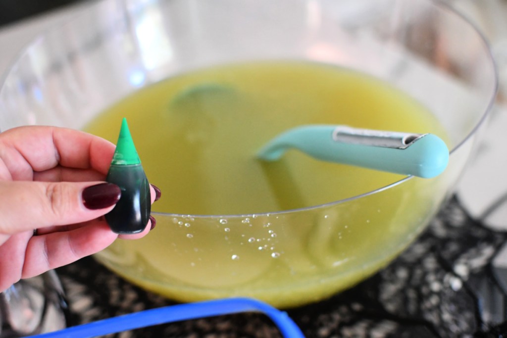 adding food coloring to punch