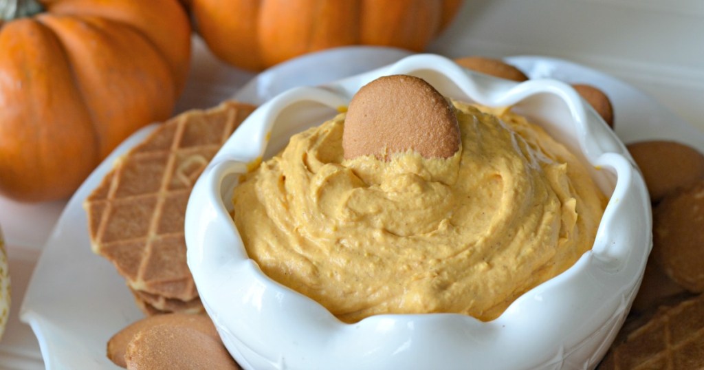 easy pumpkin dip in a bowl with cookies on the side 