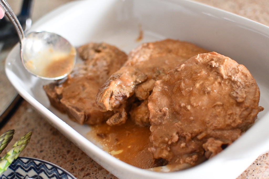 pork chops with gravy drizzled on top 