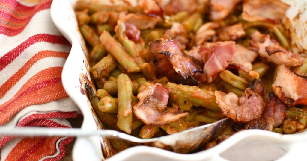 casserole dish with baked green beans and bacon