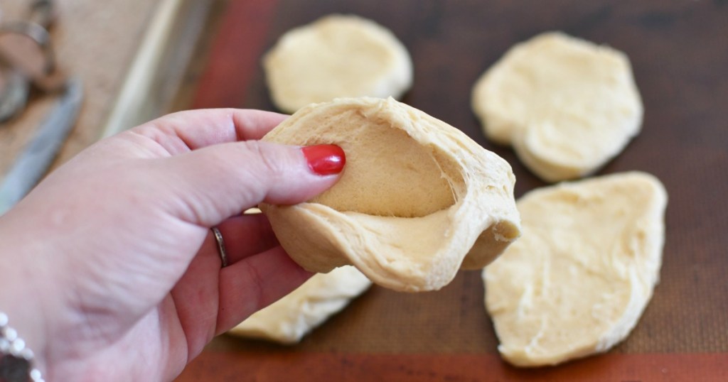 splitting flaky biscuit dough in half