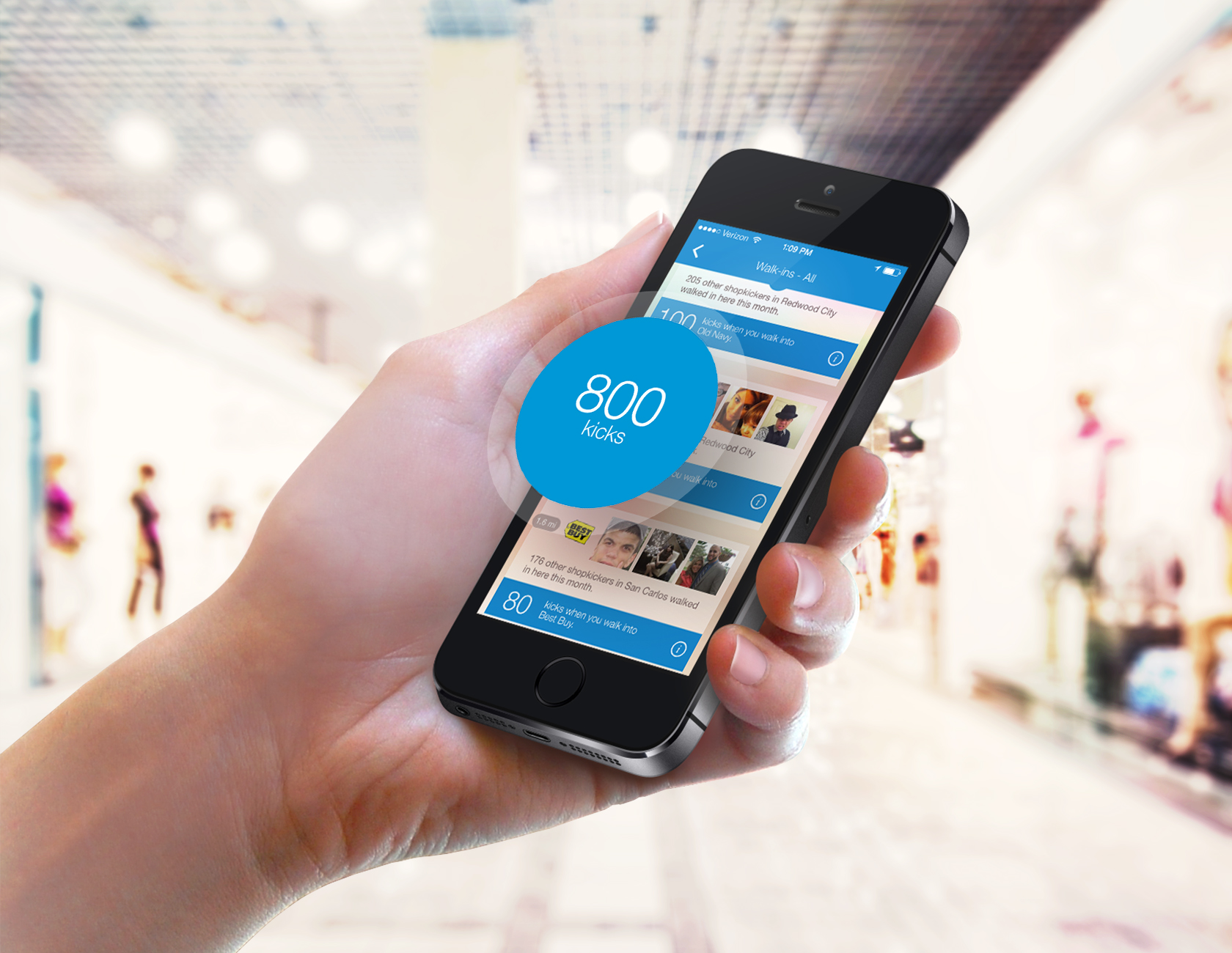 hand holding a phone with shopkick app earn free gift cards displaying on the screen