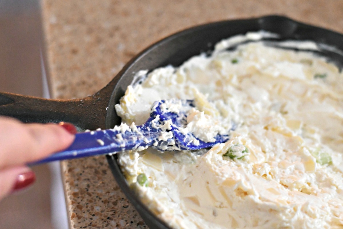 6-ingredient Swiss cheese bacon dip – smoothing out the dip in a pan