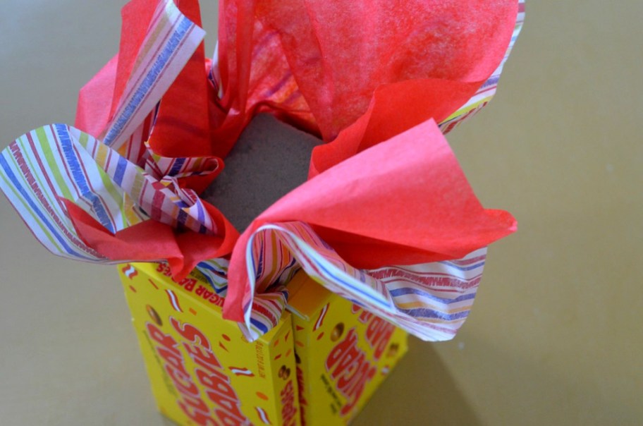 candy bouquet diy gift for birthday using Dollar Tree floral foam, tissue paper, and candy