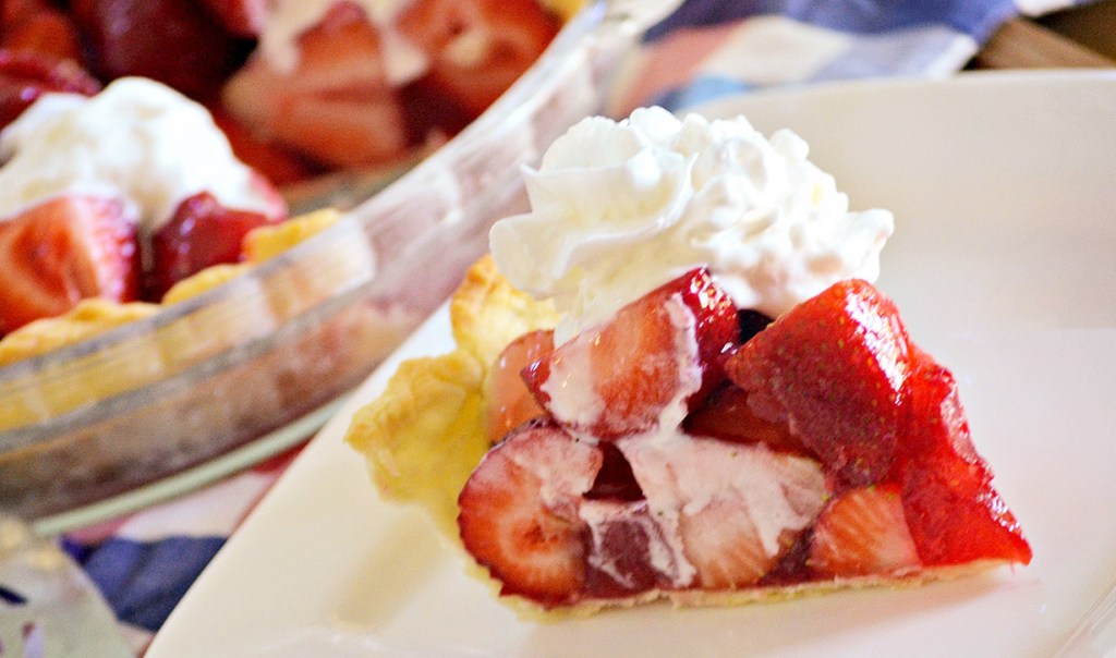 slice of strawberry pie with whipped cream
