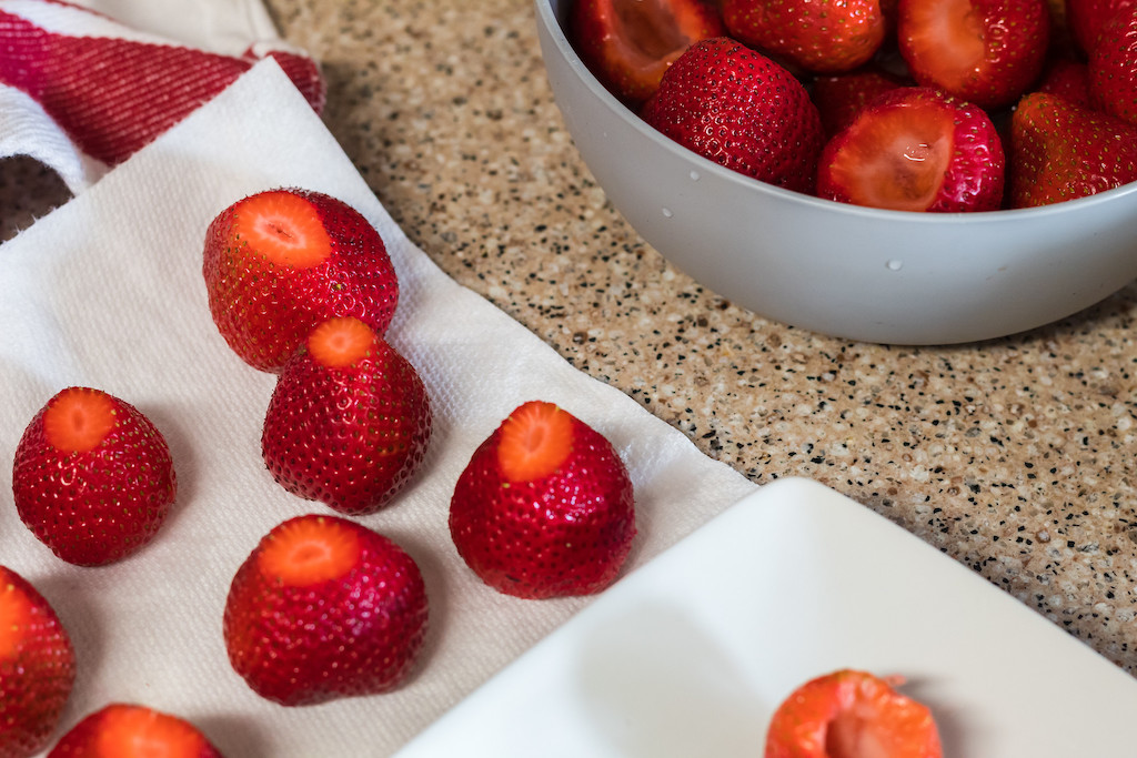strawberries sitting on paper towel with bottom cut 
