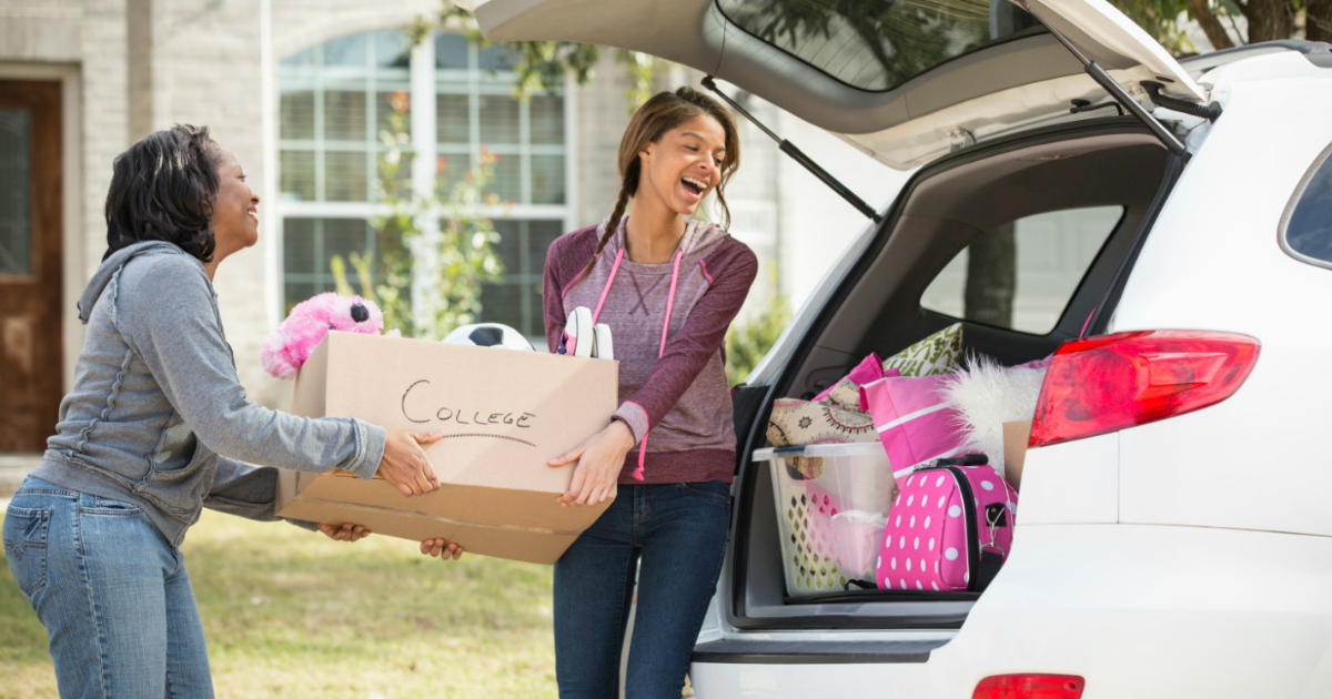 The top 15 things to take to college – Two women loading a car with items for college