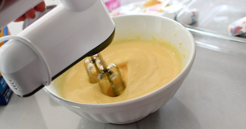 using a hand mixer to make vanilla pudding