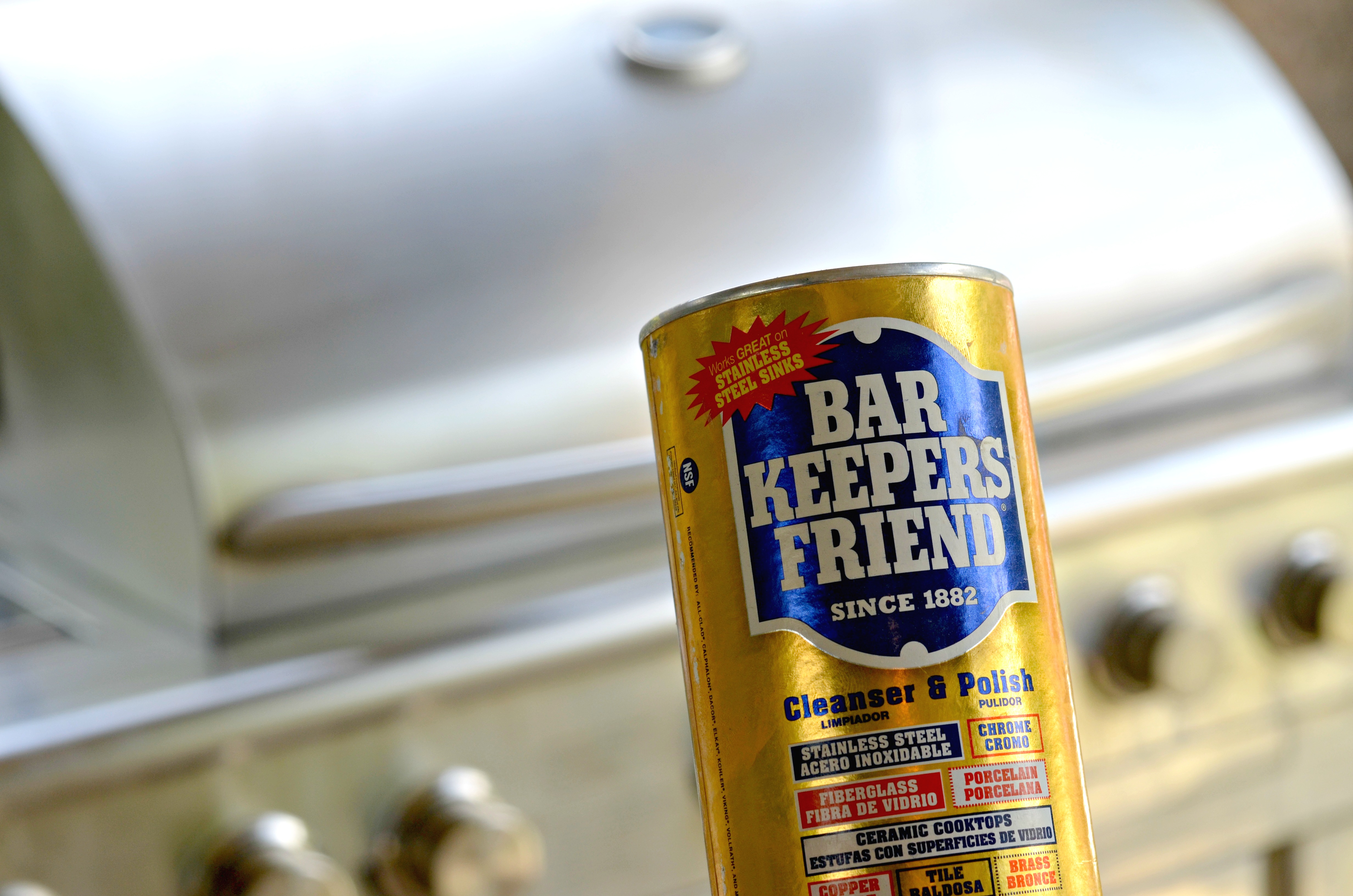 Bar Keepers Friend in front of a barbecue grill