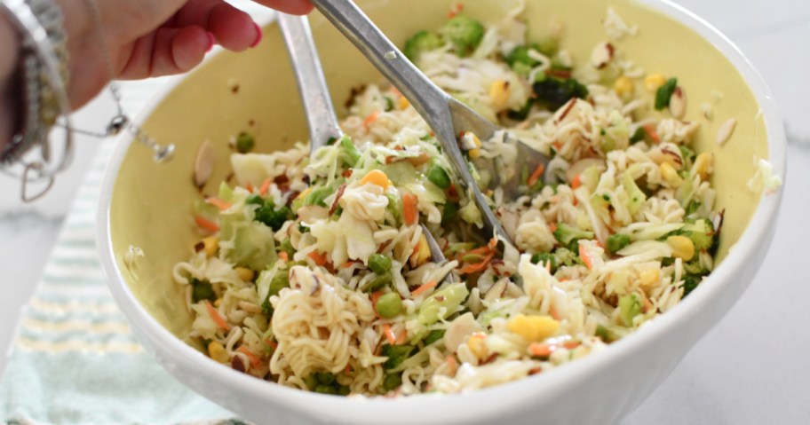 tossing ramen noodle salad, one of our favorite meal ideas and easy recipes that uses rotisserie chicken 