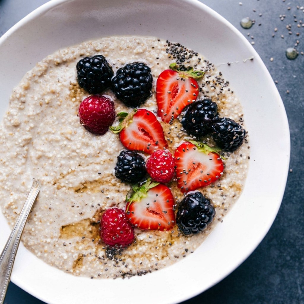 oatmeal with berries in white bowl