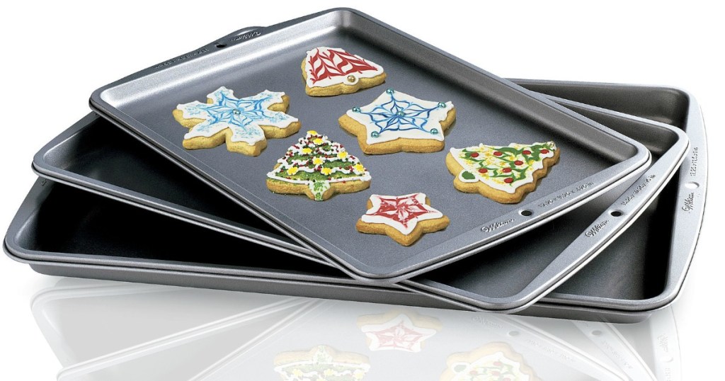 three silver cookie sheets