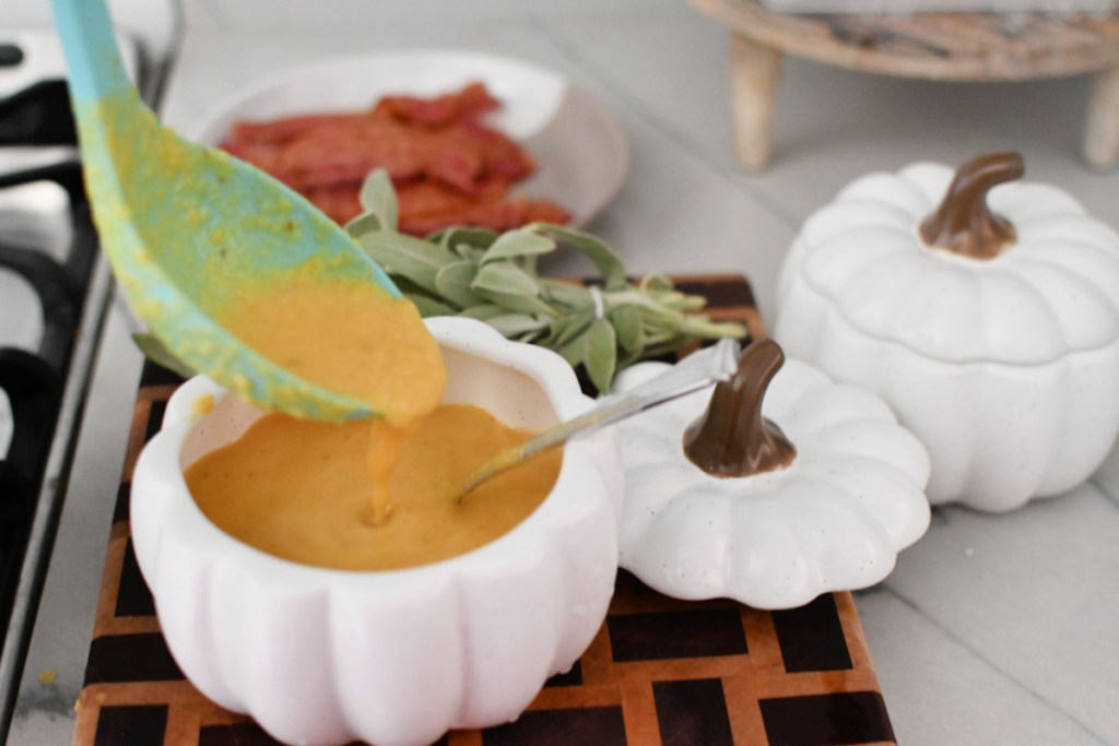 easy butternut squash soup recipe in a pumpkin shaped bowl