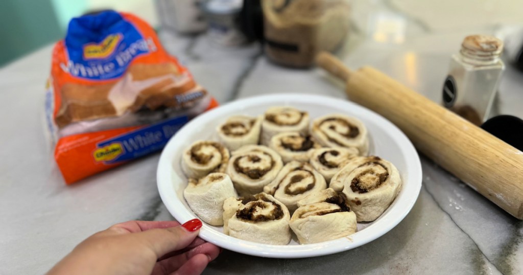 cinnamon rolls in a pie pan before baking