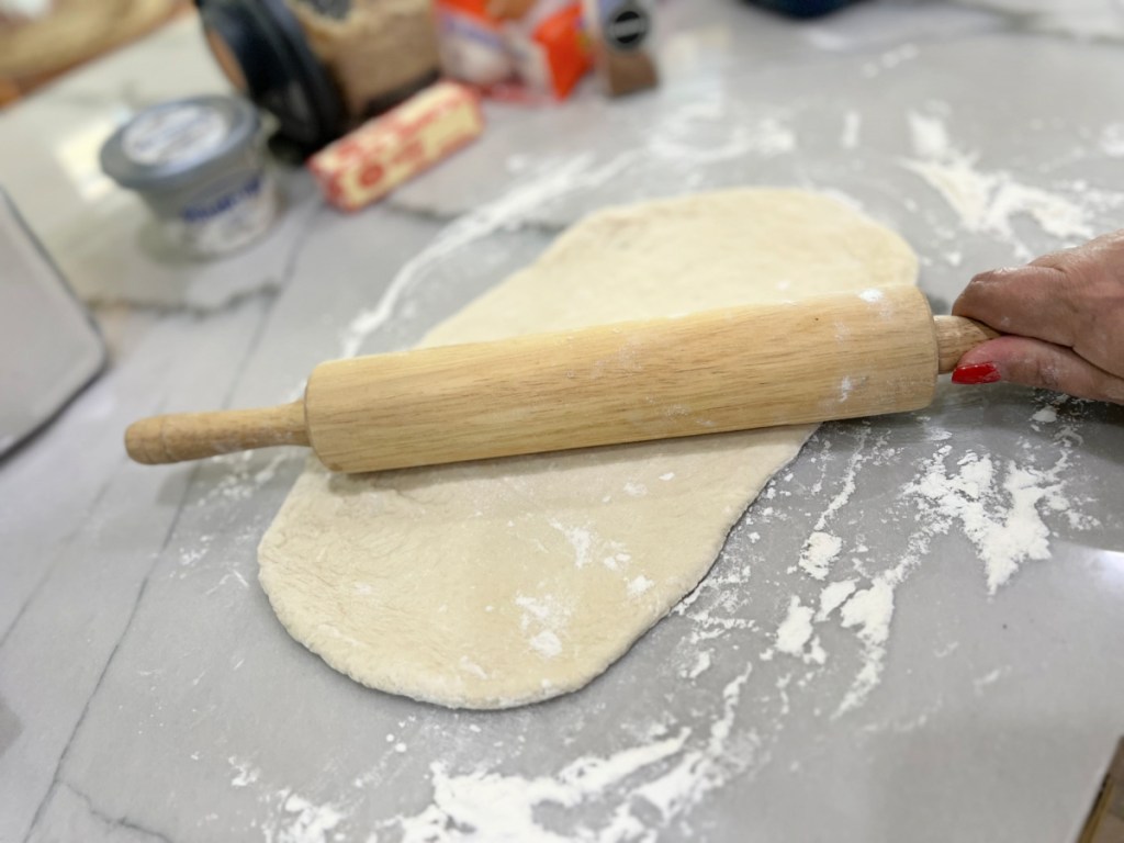 rolling out rhodes bread dough on the counter