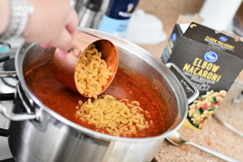adding pasta to goulash