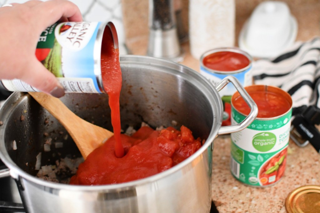 adding tomato sauce to goulash