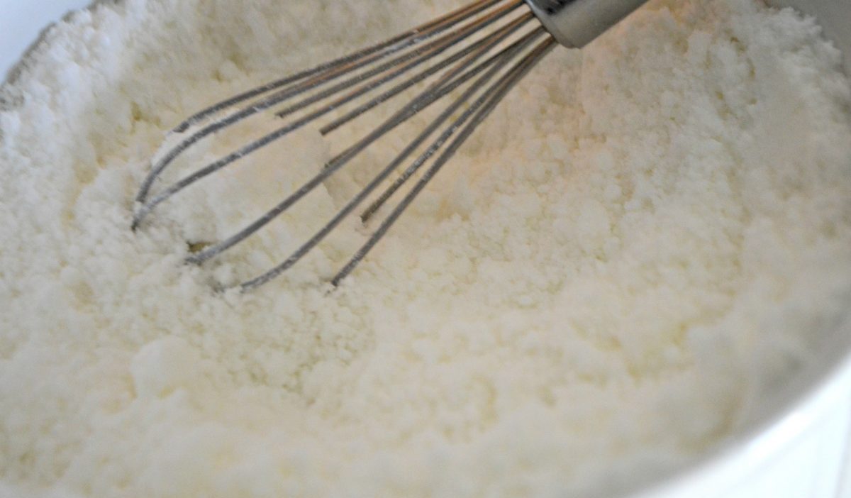 whisk stirring dry white ingredients in a bowl